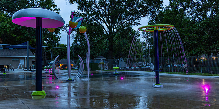 Lions Park splash pad with LED Accent Lights lit up at night 